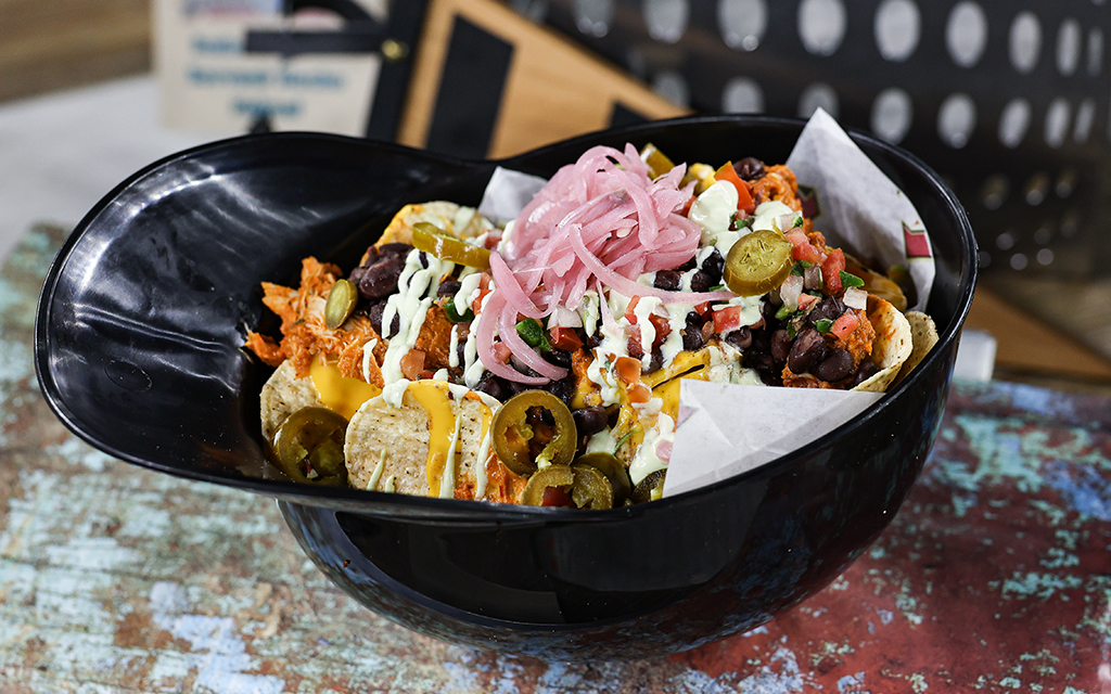 The Chicken Tinga Souvenir Nacho Helmet is another ballpark take on a classic, this time a Mexican dish normally made with tomato, chipotle chilis in adobo, and onion. (Photo by Ethan Briggs/Cronkite News)