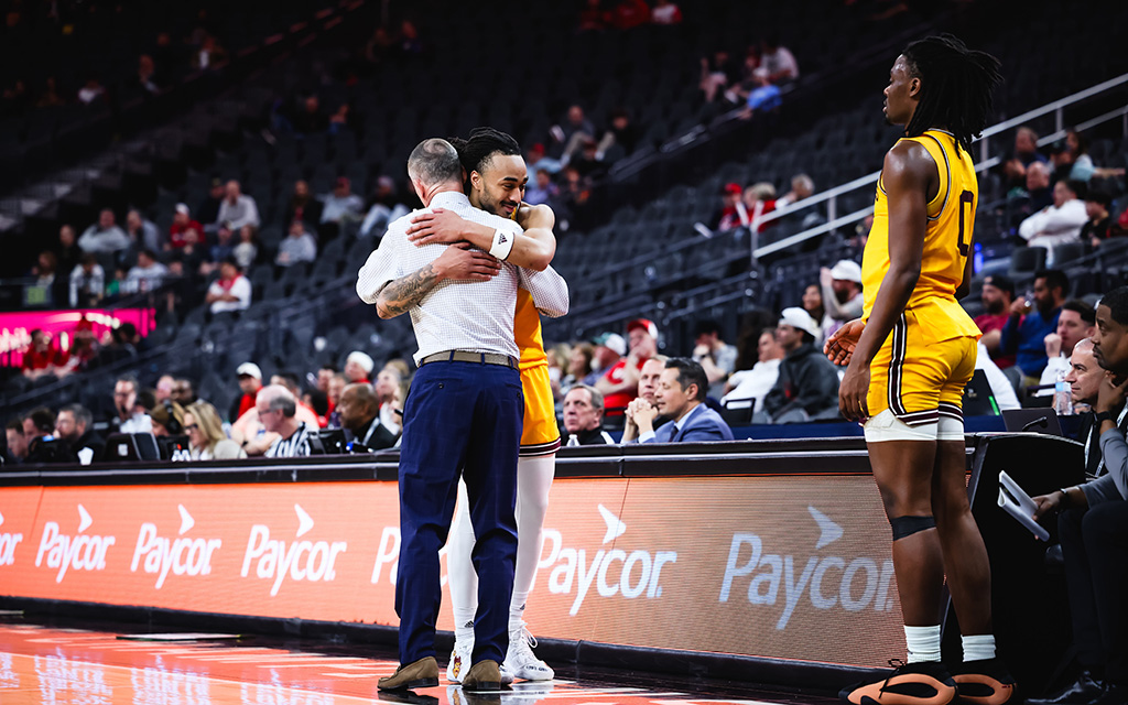 Arizona State guard Frankie Collins hugs coach Bobby Hurley as he subs out for the final time in the Sun Devil’s 90-57 loss to Utah in the first round of the 2024 Pac-12 Tournament at T-Mobile Arena in Las Vegas, Nevada. (Photo by Dominic Contini/Cronkite News)