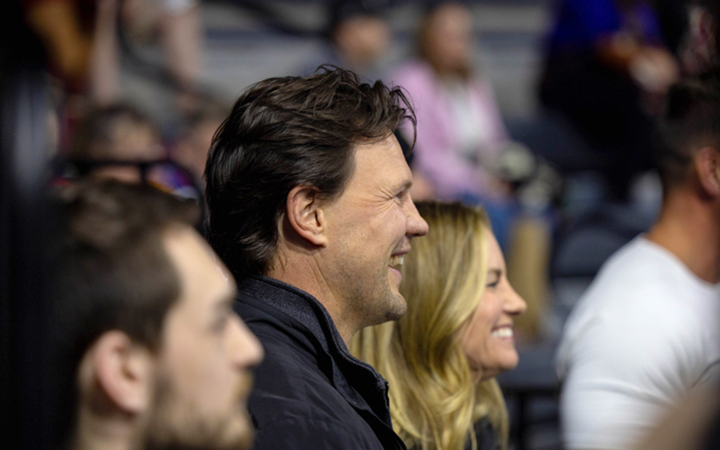 Shane Doan, who played with the Arizona Coyotes for 21 years, watches from the stands as his son, Josh, skates in the same arena as the one in college. (Photo by Reece Andrews/Cronkite News)