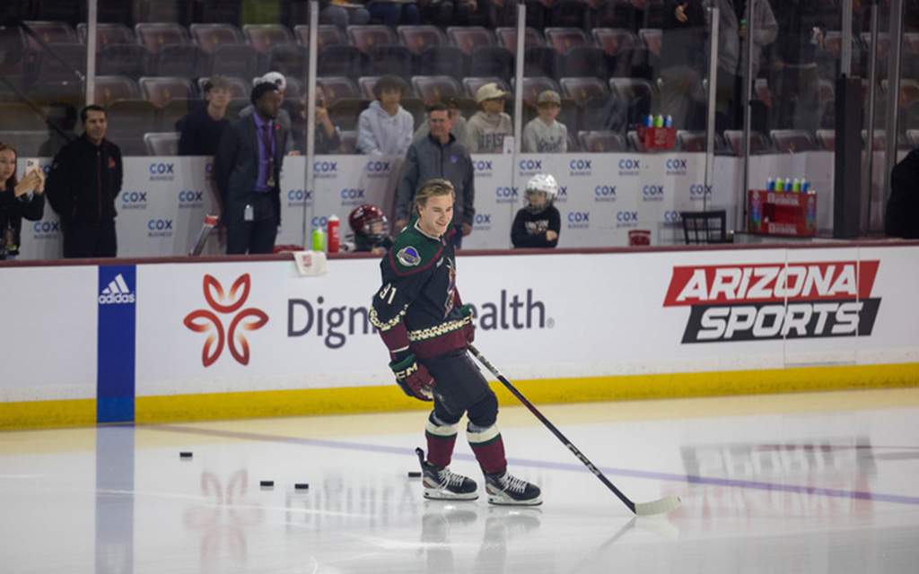 Josh Doan smiles as he takes the ice before his NHL debut in Mullett Arena in front of family and friends. (Photo by Reece Andrews/Cronkite News)