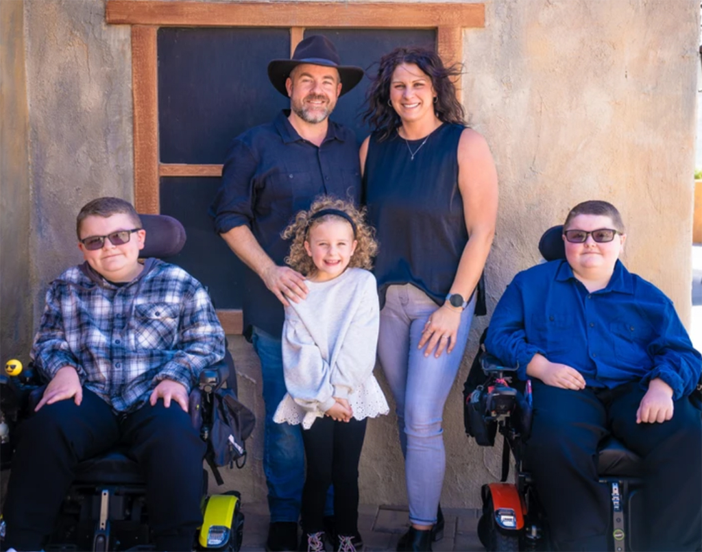 The Mogensen boys – Jaxton, left, and Mason, right – love to ski using adaptive equipment. Their parents, Blaine and Melissa, want their children to live as normal lives as possible. (Photo courtesy of Melissa Mogensen)