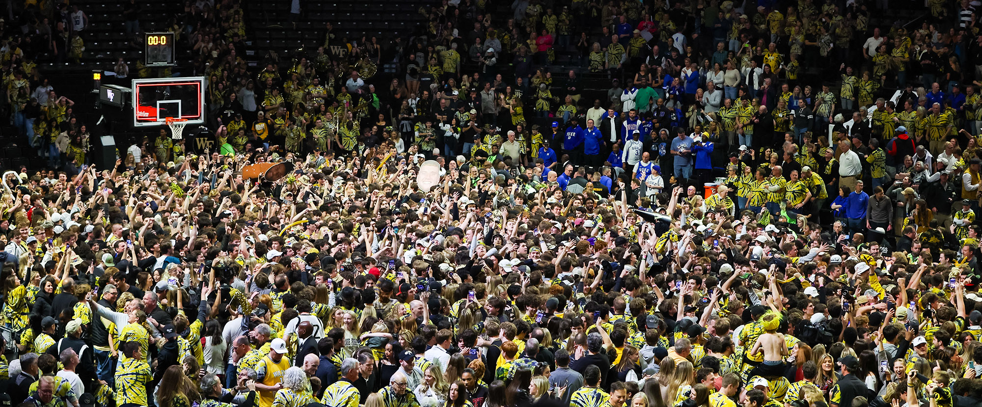 Wake Forest fans storm the court after a basketball game against Duke at Lawrence Joel Veterans Memorial Coliseum in Charlotte, North Carolina, recently. More and more incidents have raised questions about regulations. (Photo by David Jensen/Icon Sportswire via Getty Images)
