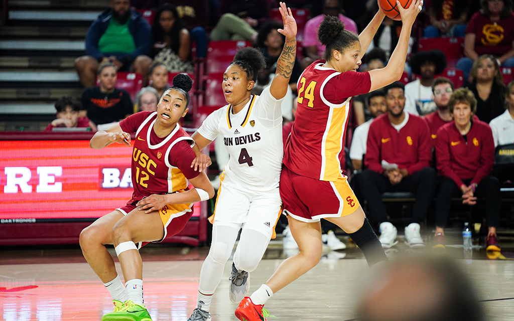 ASU guard Trayanna Crisp, centers, defends USC’s JuJu Watkins, left, and Kaitlyn Davis in the Sun Devils’ last regular season game before heading off to compete in the Pac-12 Women’s Basketball Tournament. (Photo by Emma Jeanson/Cronkite News)