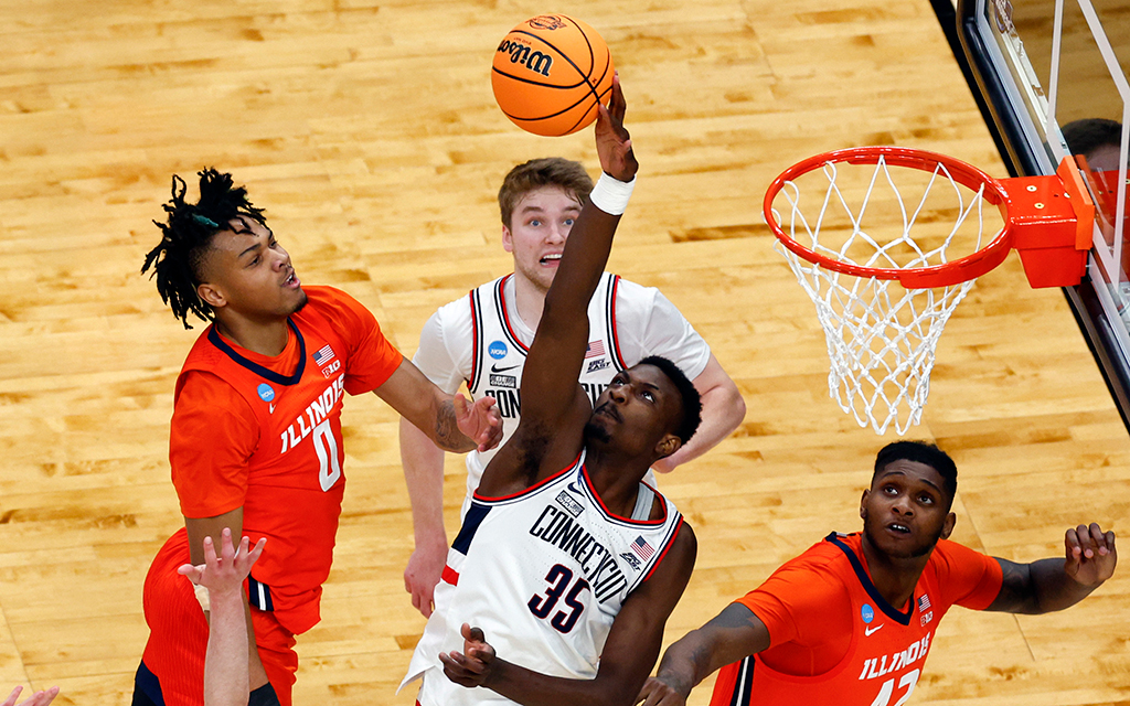 UConn forward Samson Johnson blocks an Illinois shot in the second half of the NCAA East Regional Elite 8 game at TD Garden. The Huskies are one of the teams that will play in Glendale this weekend. (Photo by Danielle Parhizkaran/The Boston Globe via Getty Images)