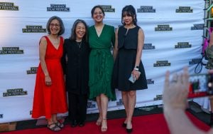 From left, Nina Newell, Cindy Lee, Phoebe Newell and Kat Aparicio pose for a photo during the Phoenix Film Festival’s opening night in Scottsdale on April 4, 2024. Lee’s film "The Stories They Didn't Tell Us – Nina's Story," which recounts Nina Newell’s experiences as a refugee in Vietnam, premiered Thursday at the festival. “There’s so many aspects to the story, but part of it is the love of a mother and the intention with which she raised them (her children) to not put her trauma on them,” Lee says. (Photo by Kayla Mae Jackson/Cronkite News)