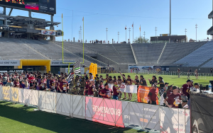 Arizona State football players line up to cheer on first responders and other participants near the Mountain America Stadium finish line for Pat’s Run. (Photo by Anthony Remedios/Cronkite News)
