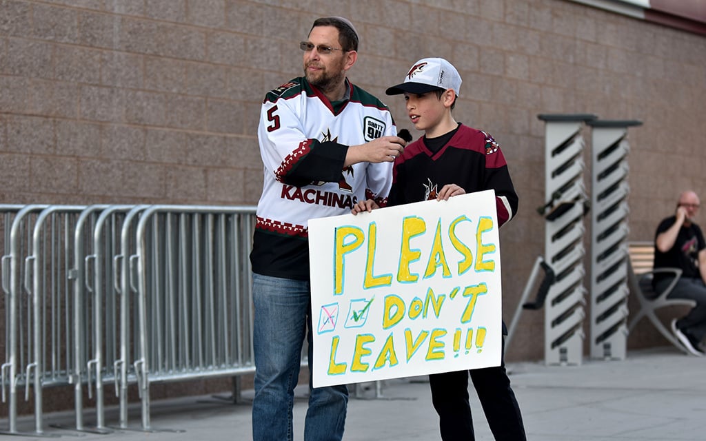 Amid the uncertainty of relocation, devoted fans stand outside Mullett Arena as a symbol of solidarity and love for their beloved Arizona Coyotes. (Photo by Joseph Eigo/Cronkite News)