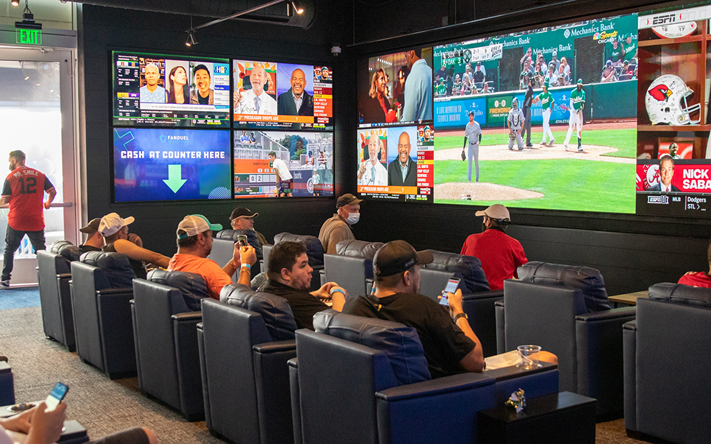 The bright lights and screens of the FanDuel Sportsbook attract fans inside Footprint Center, offering a unique sports betting atmosphere just steps away from the court. (File photo by James Franks/Cronkite News)