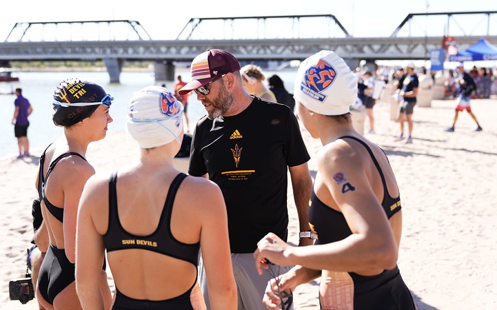 Cliff English instructs his ASU triathlon team during a practice session at Tempe Town Lake, where the Sun Devils have won six straight NCAA championship events. (Photo by Peter Vander Stoep/Photography AZ)