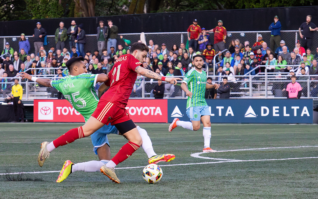 Phoenix Rising winger Panos Armenakas dribbles past a Seattle defender in the U.S. Open Cup Round of 16. Las Vegas is next for Rising, who went winless on their recent roadtrip. (Photo courtesy of Phoenix Rising)