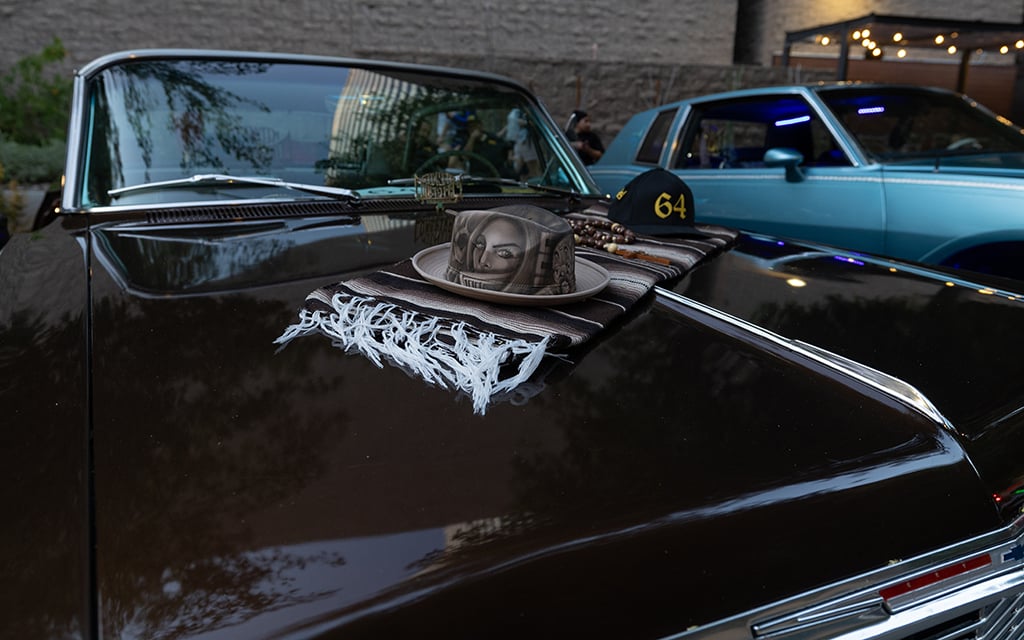 Lowriders in downtown Phoenix are adorned with Chicano, Mexican and Mexican American symbols, such as the serape, a traditional blanket, and the rosary, on April 13, 2024. (Photo by David Ulloa Jr./Cronkite News)