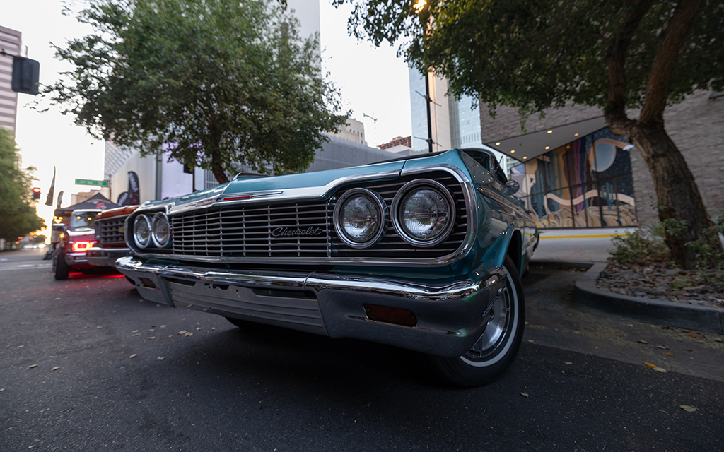 Lowriders from different eras line the parking lot outside of the Arizona Latino Arts & Cultural Center for the second Saturday of the month car show in downtown Phoenix on April 13, 2024. (Photo by David Ulloa Jr./Cronkite News)
