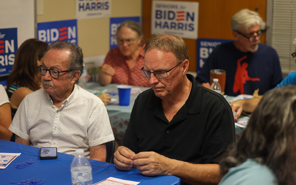 A Seniors for Biden-Harris kickoff event in Phoenix on June 13, 2024: “It gives you a more personal connection with somebody, especially this event with all retired people,” said Gary Glatting, right. “That means there’s interest in our generation.” (Photo by Grace Hand/Cronkite News)