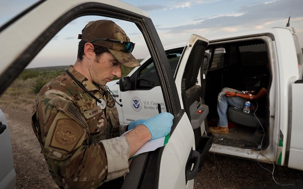 A U.S. Border Patrol Search, Trauma, and Rescue (BORSTAR) agent creates a medical report near Eagle Pass, Texas. (Photo by Glenn Fawcett/CBP)
