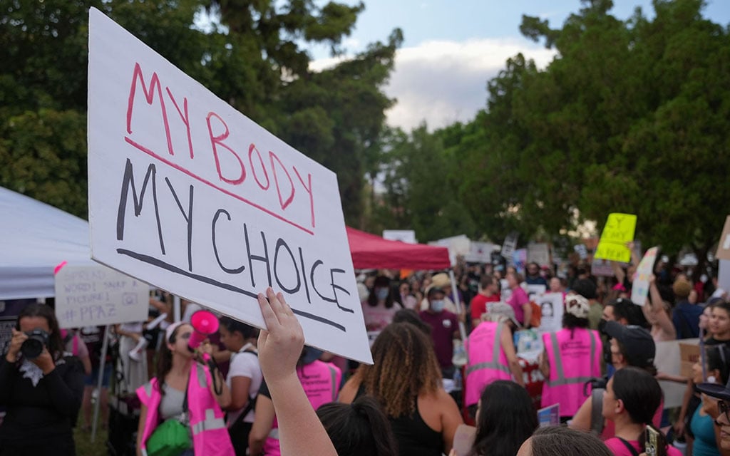Abortion-rights activists rally outside the Arizona Capitol in June 2022 to protest the U.S. Supreme Court’s ruling in Dobbs, which overturned Roe v. Wade. The Arizona Supreme Court’s enactment of an 1864 law and its subsequent repeal has brought abortion and related issues like contraception to a new level of salience in Arizona. (File photo by Troy Hill/Cronkite News)