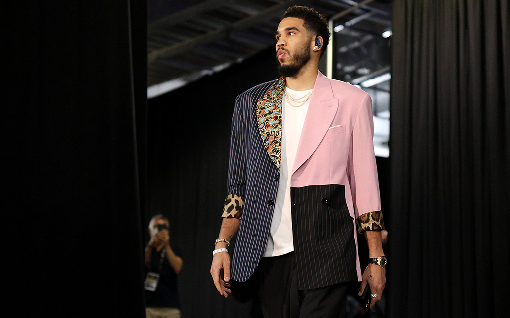Jayson Tatum's versatile fashion sense, ranging from classic suits to casual streetwear, mirrors his game on the court as an All-Star for the Boston Celtics. (Photo by Ezra Shaw/Getty Images)