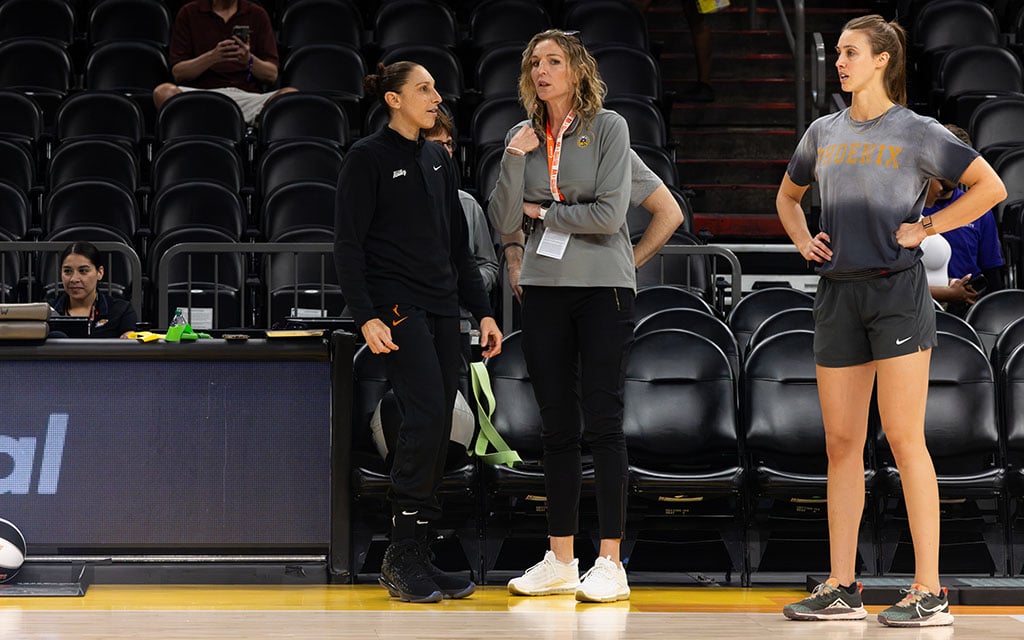 Phoenix Mercury guard Diana Taurasi, from left to right, Sparks general manager Raegan Pebley and Mercury strength and conditioning coach Annalise Pickrel converse Sunday at Footprint Center. (Photo by Shirell Washington/Cronkite News)