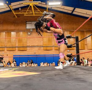 Professional wrestler Zamaya, right, delivers a powerful counter to toss Rachelle Riveter across the ring at a Phoenix Championship Wrestling event. (Photo courtesy of Phoenix Championship Wrestling)