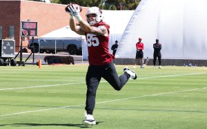 Cardinals tight end Trey McBride catches a pass during practice. The Cardinals’ offseason has been free of drama and contract holdouts. (Photo by Shirell Washington/Cronkite News)