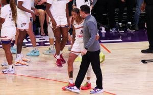 Phoenix Mercury coach Nate Tibbetts credits his success to the support of veteran players like Natasha Cloud, seen here discussing game strategy. (Photo by Shirell Washington/Cronkite News)