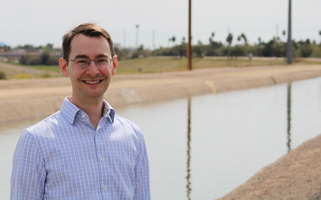 Brett Fleck stands by the Arizona Canal in Peoria on March 18, 2024. The water department he manages is focused on making sure taps keep flowing in the long term, even as Peoria's main source of water shrinks. (Photo by Alex Hager/KUNC)