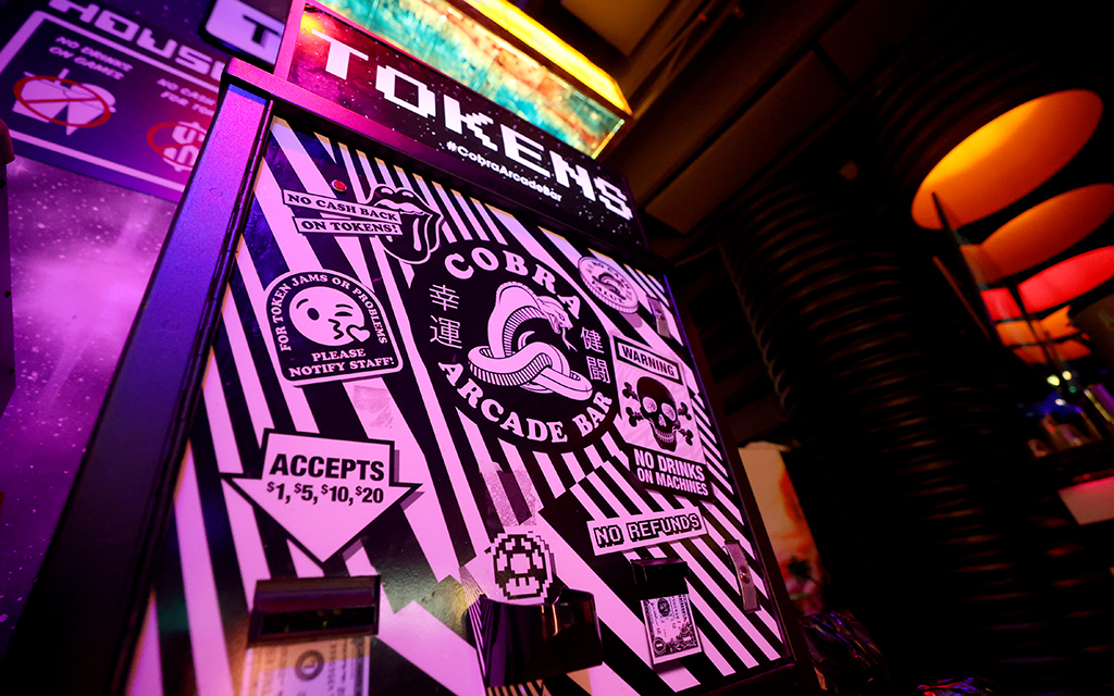 The token machine at Cobra Arcade Bar in Phoenix on June 26, 2024. (Photo by Stella Subasic/Cronkite News)