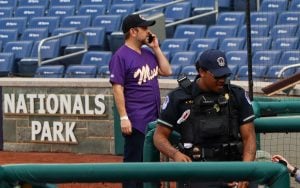 Rep. Ruben Gallego takes a phone call before the Congressional Baseball Game at Nationals Park in Washington, D.C., on June 12, 2024. (Photo by Morgan Kubasko/Cronkite News)