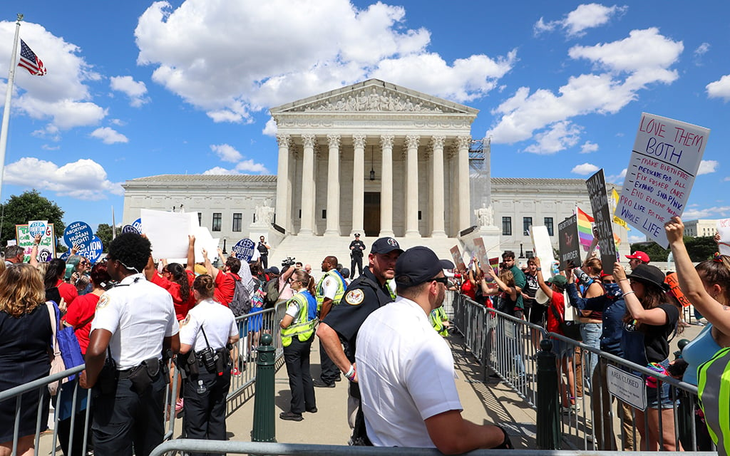 Abortion rights and anti-abortion protesters are separated by barriers at the Supreme Court in Washington, D.C., on June 24, 2024. (Photo by Morgan Kubasko/Cronkite News)