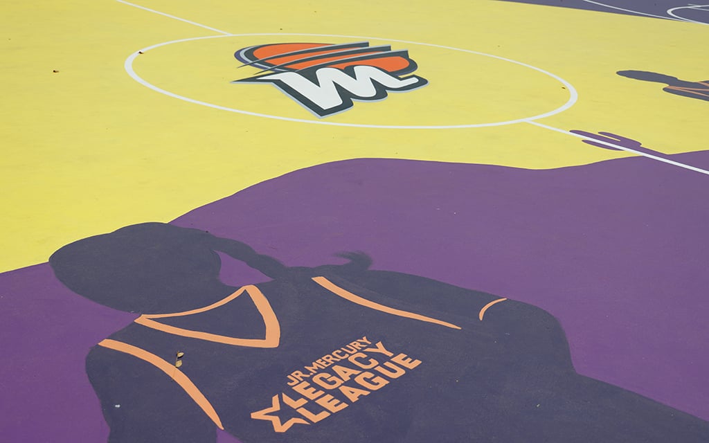 The design highlights Mercury players like Diana Taurasi and Brittany Griner alongside a silhouette of a Jr. Mercury Legacy League member. (Photo by Grace Hand/Cronkite News)