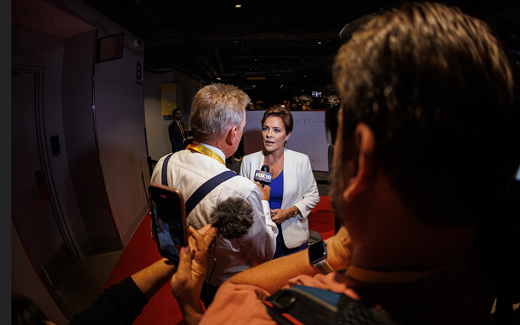 Kari Lake speaks with news media after her speech at the Republican National Convention in Milwaukee on July 16, 2024. The former journalist and frequent critic of the media called out the press during her speech: “Frankly, you guys up there in the fake news have worn out your welcome. … You have spent the last eight years lying about President Donald Trump and his amazing patriotic supporters.” (Photo by Hudson French/News21)