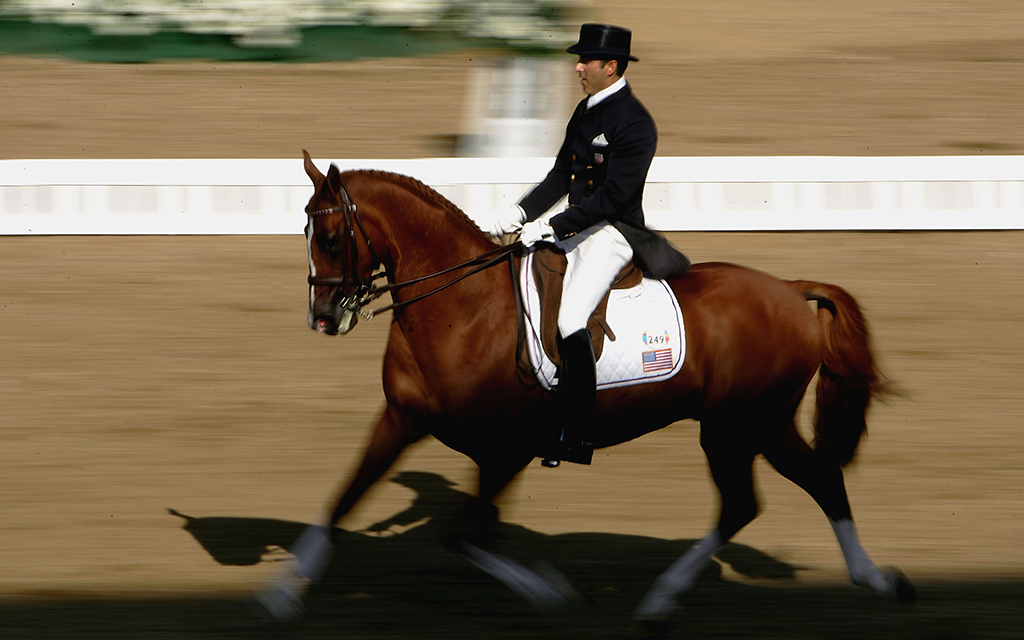 Robert Dover of the U.S. competed in the individual dressage grand prix freestyle event during the Athens 2004 Summer Olympics. He is believed to first the Olympian to come out publicly as gay. (Photo by Chris McGrath/Getty Images)