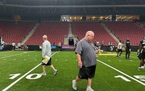 Coach Kevin Guy motivates his team during a must-win game against the Northern Arizona Wranglers on June 15 as the Arizona Rattlers push for a playoff spot. (Photo by Dylan Slager/Cronkite News)