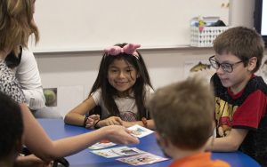 In this 2022 photo, students work with a teacher at Encanto Elementary School in Phoenix. (File photo by Sophie Oppfelt/Cronkite News)