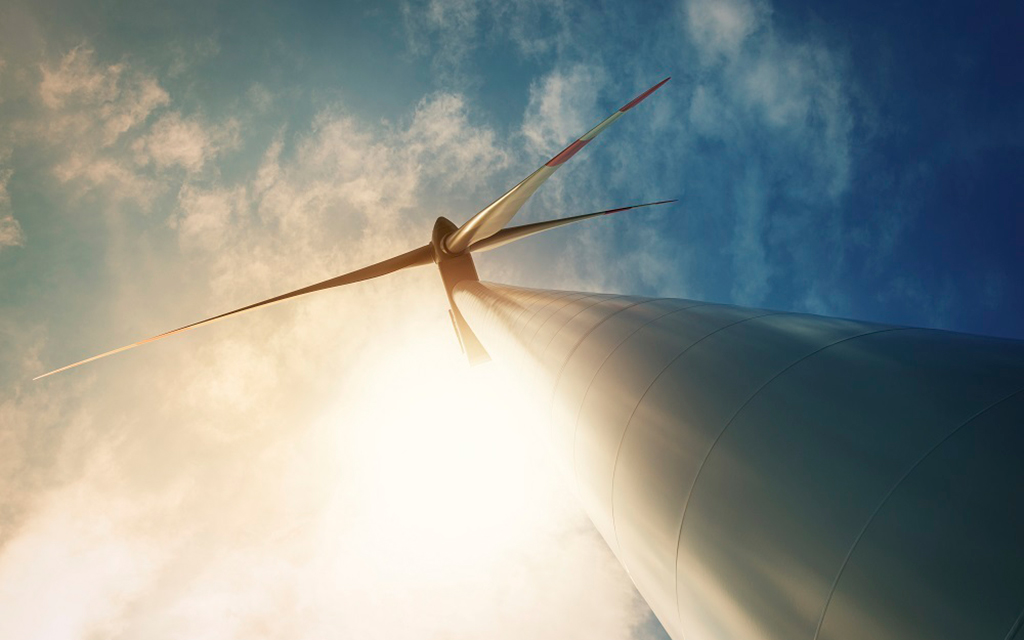 A low angle photo of a wind turbine on June 19, 2012. (Photo courtesy of the U.S. Department of Energy)