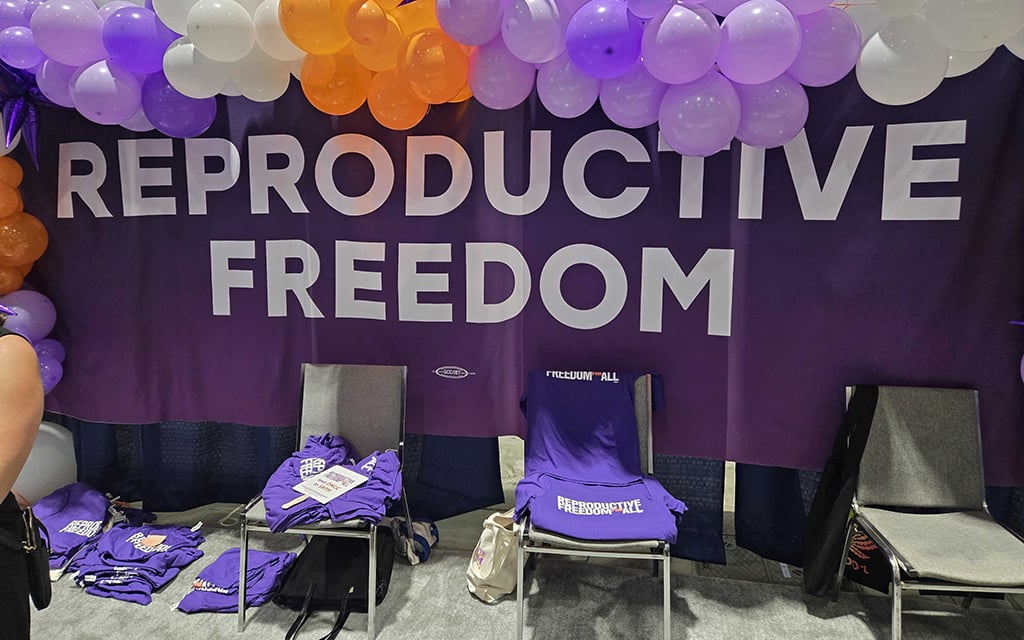 Reproductive freedom information booths and merchandise at Democratic National Convention in Chicago, Aug. 20, 2024. (Cronkite News photo)