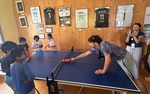 Children play table tennis at the Féte le Mur building in the La Courneuve neighborhood. The Paris Games brought attention to government assistance for the program. (Photo by Zach Bradshaw/Special for Cronkite News)