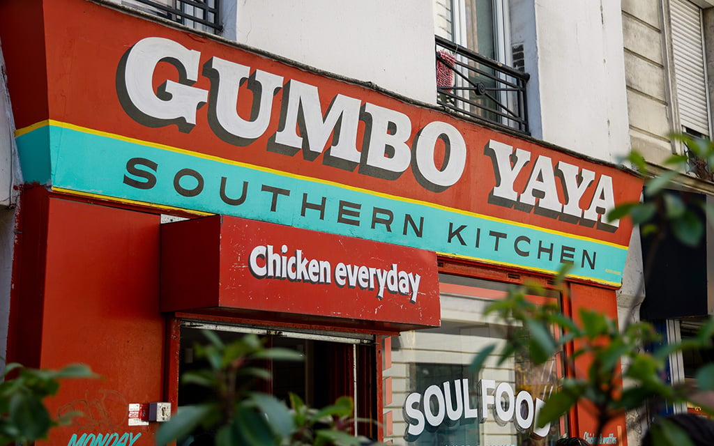 The front of the restaurant Gumbo YaYa Southern Kitchen in Paris, France, invites diners who want a different culinary experience in the City of Light. (Photo by Sydney Lovan/Special for Cronkite News)