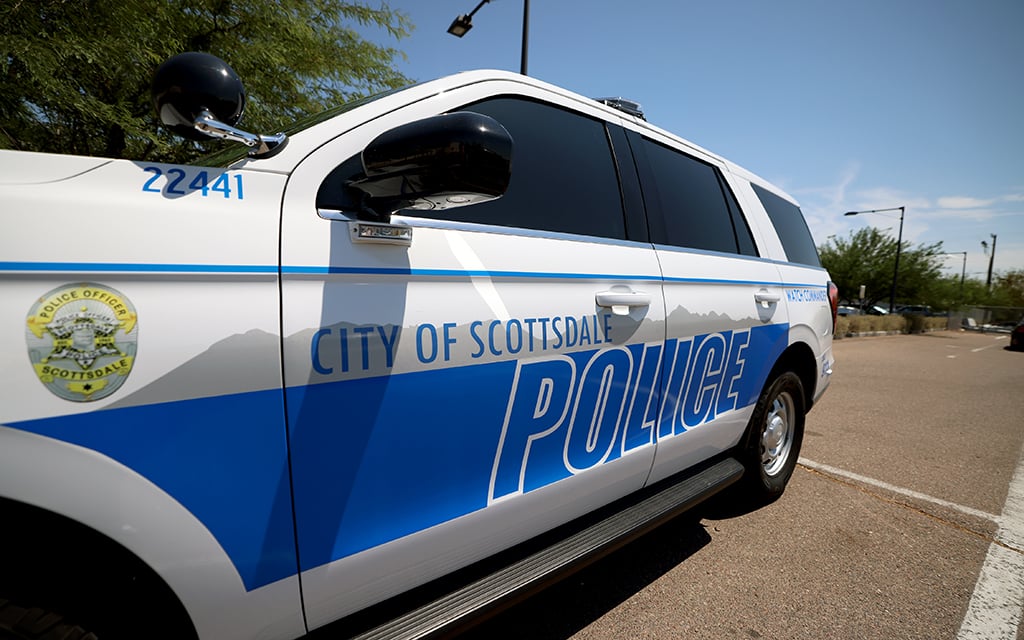 A police vehicle sits outside of the Scottsdale Police Department on July 15, 2024. Many sexual exploitation cases that Scottsdale detectives are coming across begin with online games. (Photo by <a href="https://cronkitenews.azpbs.org/people/stella-subasic/" rel="noopener" target="_blank">Stella Subasic</a>/Cronkite News)