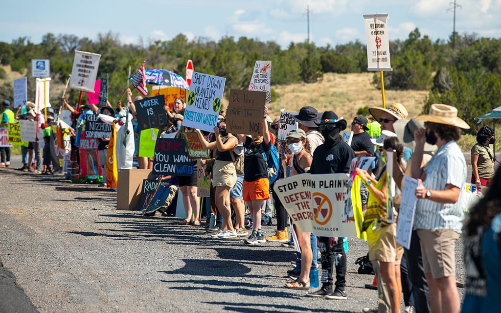 Protesters voice their opposition to uranium hauling from the Pinyon Plain Mine on Aug. 4, 2024. (Photo by Blake McCord via Grand Canyon Trust)