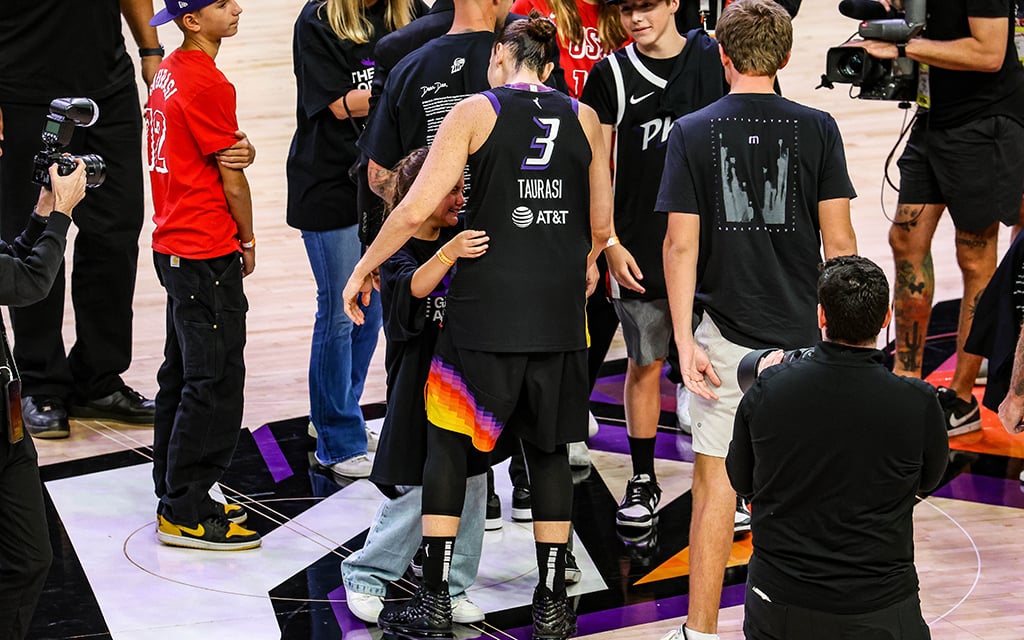 Diana Taurasi embraces a crying girl after what is potentially the final home game of her 20-year career. (Photo by Spencer Barnes/Cronkite News)