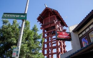 The Japanese Village Plaza in LA’s Little Tokyo with a sign for "CHINCHIKURIN Japanese Teppan Dining," next to a "Central Av" street sign.