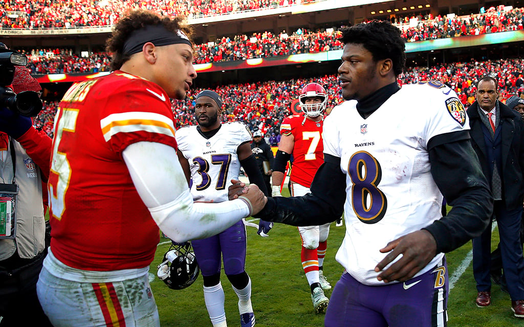 Baltimore Ravens' Lamar Jackson and Kansas City Chiefs' Patrick Mahomes shake hands on the field after a game.