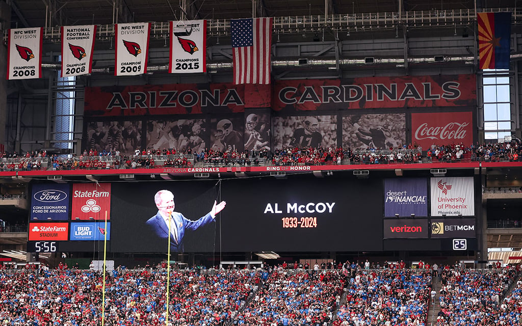 State Farm Stadium screen displaying a tribute to Al McCoy's recent passing.