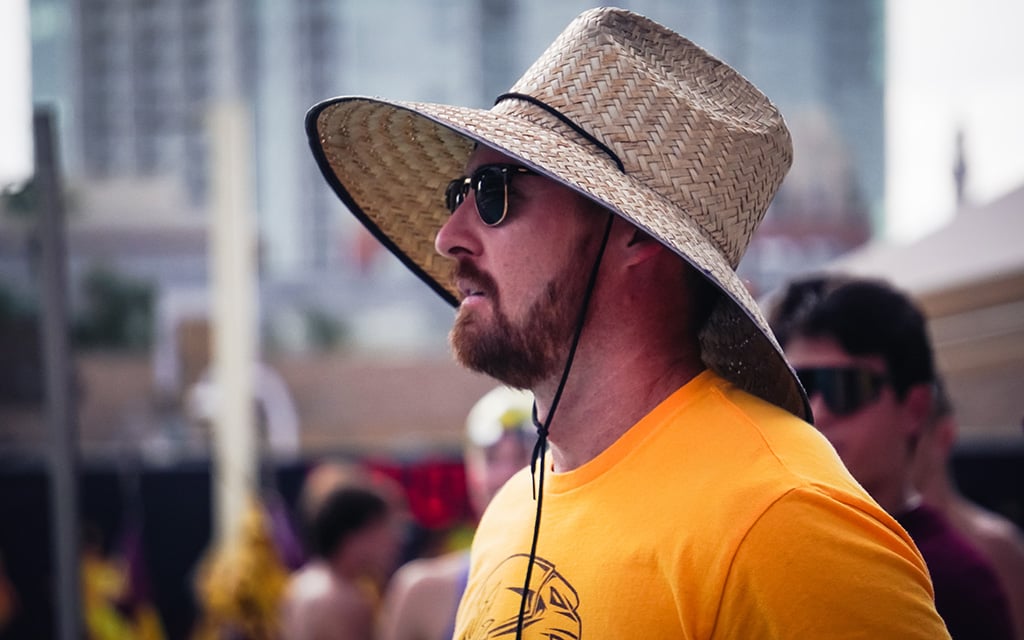 Herbie Brehm looks ahead at his team. He is in sunglasses and sun hat.