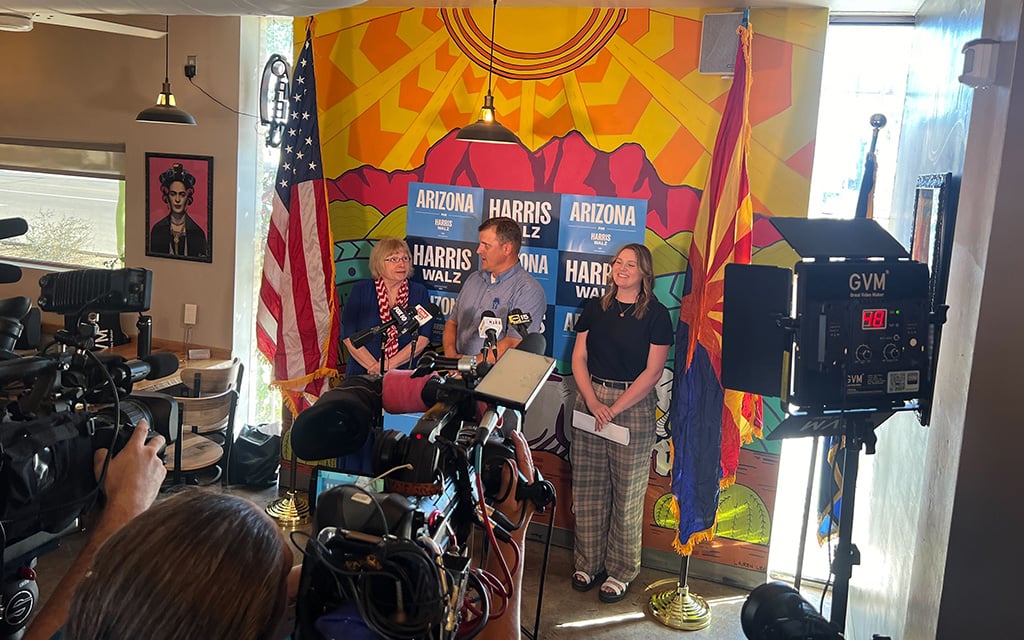 From left, Arizona Latter-day Saints for Harris-Walz Advisory committee co-chairs Claudia Walters and Joel John, and committee member Monica Chabot, hold a news conference Sept. 19, 2024, in Mesa. (Photo by Nash Darragh/Cronkite News)