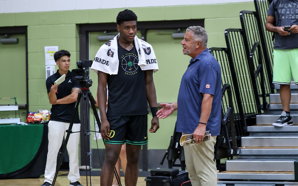 Auburn head coach Bruce Pearl looks to the right talking to four-star recruit Marcus Jackson