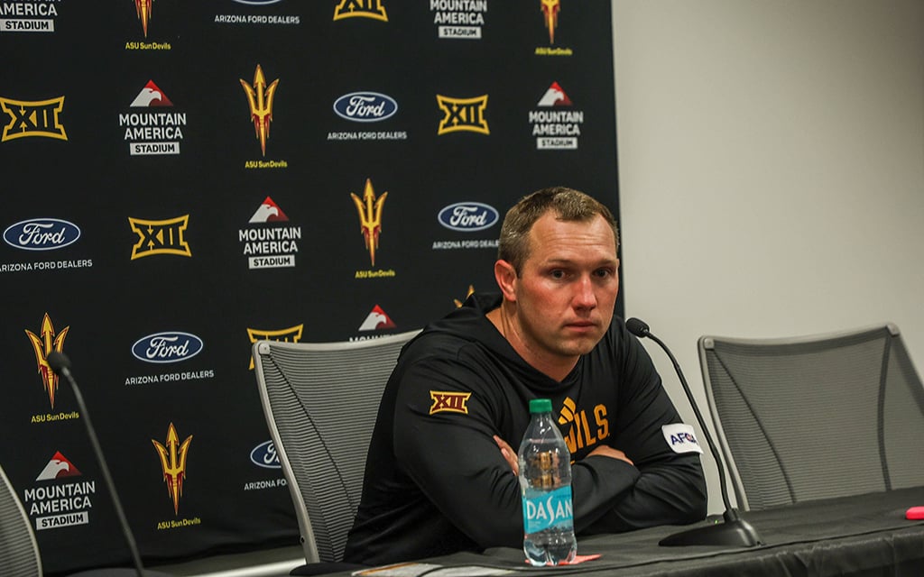 Arizona State football coach Kenny Dillingham at a press conference table.