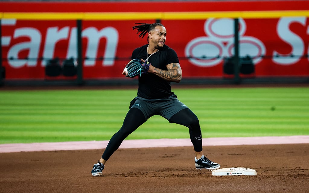 Ketel Marte preparing to throw a ball on the field during pregame.