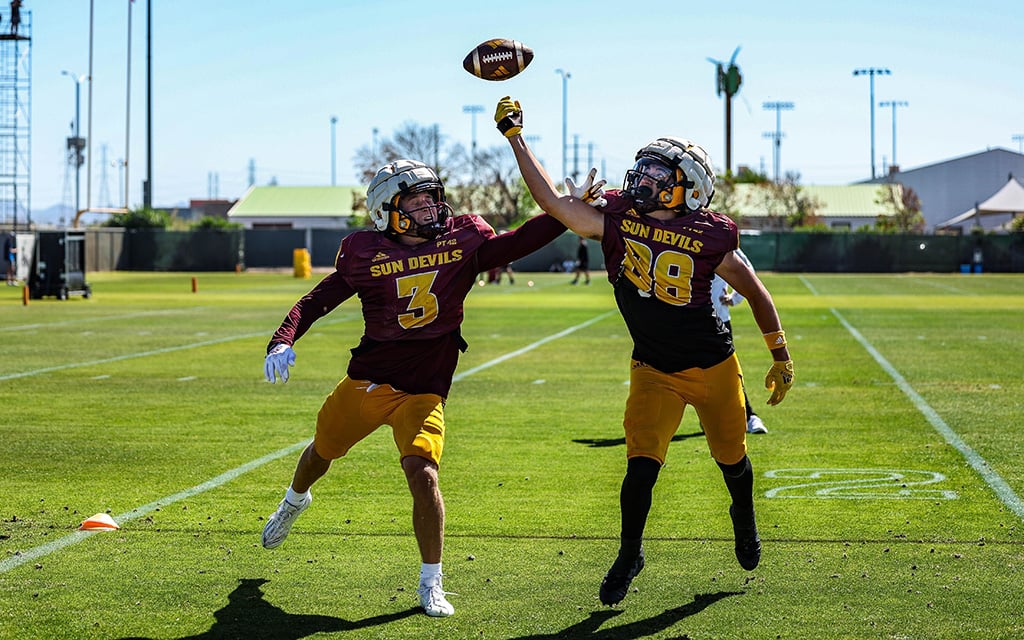 ASU wide recievers performing tip drills in practice.