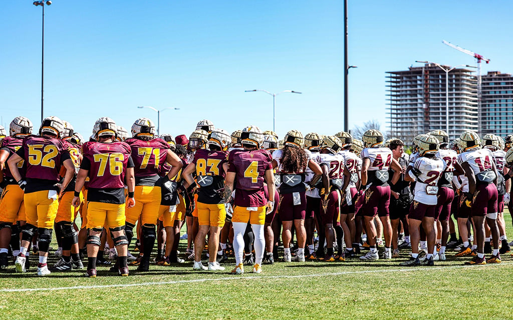 ASU football wearing guardian caps at practice.